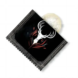 Official Callimis transparent finger condom partly unrolled from a black individual packet